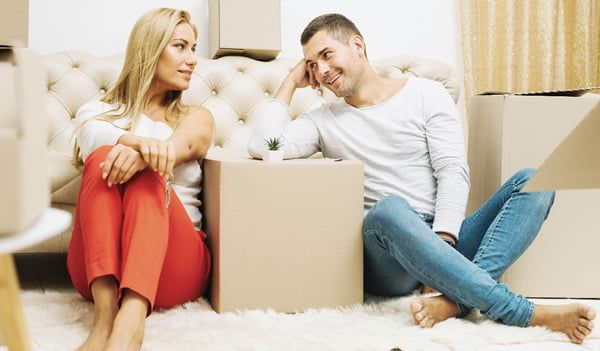 A couple relaxing after packing